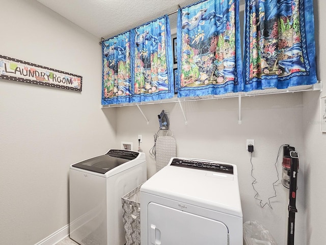 68 Los Lagos Blvd, Palm Coast, FL 32137 - laundry room featuring separate washer and dryer, baseboards, and a textured ceiling