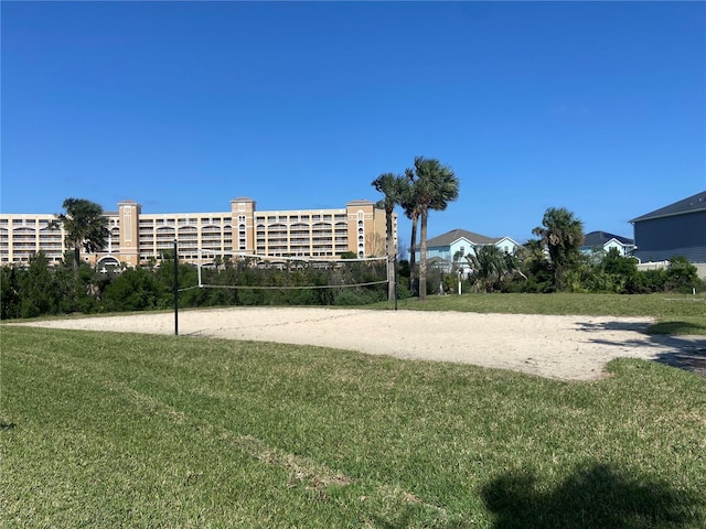 68 Los Lagos Blvd, Palm Coast, FL 32137 - view of community with volleyball court and a lawn