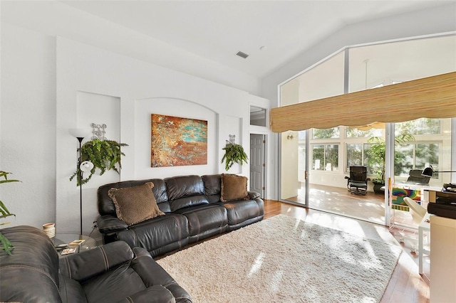 3220 Galty Cir, Ormond Beach, FL 32174 - living room featuring lofted ceiling and wood finished floors