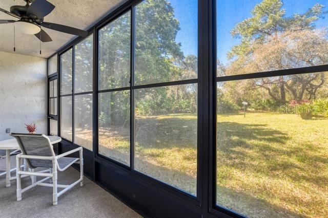 31 Catalonia Court E, Saint Augustine, FL 32086 - unfurnished sunroom featuring a wealth of natural light and a ceiling fan