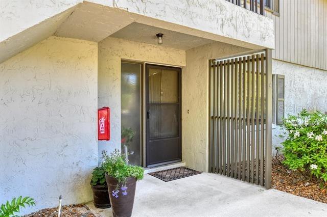 31 Catalonia Court E, Saint Augustine, FL 32086 - doorway to property featuring stucco siding