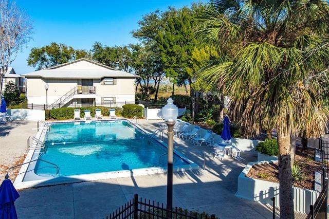 31 Catalonia Court E, Saint Augustine, FL 32086 - community pool featuring fence and a patio