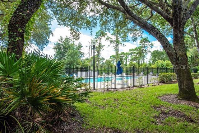31 Catalonia Court E, Saint Augustine, FL 32086 - pool featuring a yard and fence