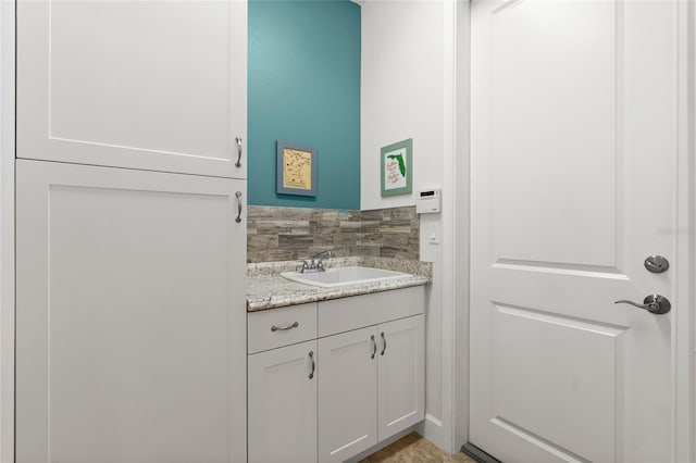 1316 Harwick Ln, Ormond Beach, FL 32174 - bathroom with vanity and decorative backsplash