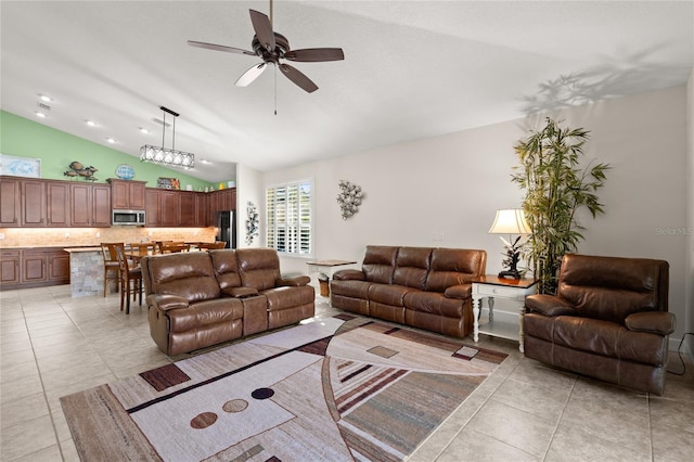 1316 Harwick Ln, Ormond Beach, FL 32174 - living area with vaulted ceiling, light tile patterned floors, and ceiling fan