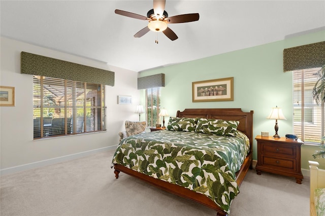 1316 Harwick Ln, Ormond Beach, FL 32174 - bedroom featuring carpet, multiple windows, baseboards, and ceiling fan