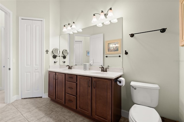 1316 Harwick Ln, Ormond Beach, FL 32174 - full bath featuring double vanity, tile patterned flooring, toilet, and baseboards