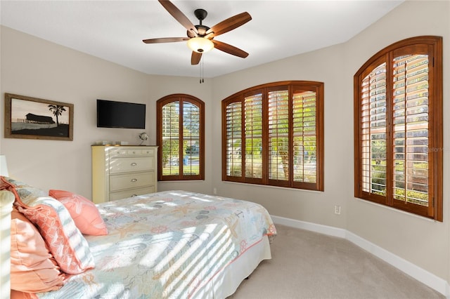 1316 Harwick Ln, Ormond Beach, FL 32174 - bedroom featuring carpet floors, baseboards, and ceiling fan