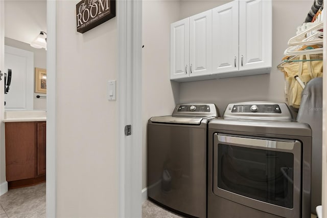 1316 Harwick Ln, Ormond Beach, FL 32174 - laundry area with washing machine and clothes dryer and cabinet space