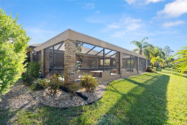 1316 Harwick Ln, Ormond Beach, FL 32174 - rear view of property featuring a yard and a lanai