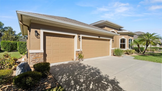 1316 Harwick Ln, Ormond Beach, FL 32174 - view of front of property with stone siding, driveway, an attached garage, and stucco siding