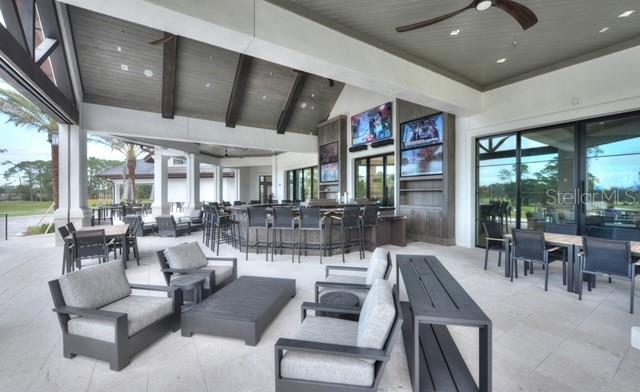 1316 Harwick Ln, Ormond Beach, FL 32174 - view of patio / terrace with outdoor lounge area, exterior bar, and a ceiling fan
