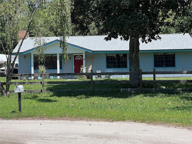 9 Shadow Ln, Ormond Beach, FL 32174 - ranch-style house featuring a porch and a shingled roof