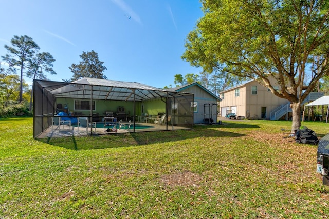 9 Shadow Ln, Ormond Beach, FL 32174 - view of grassy yard with a patio, an outdoor pool, and a lanai