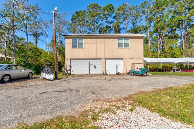9 Shadow Ln, Ormond Beach, FL 32174 - garage featuring driveway