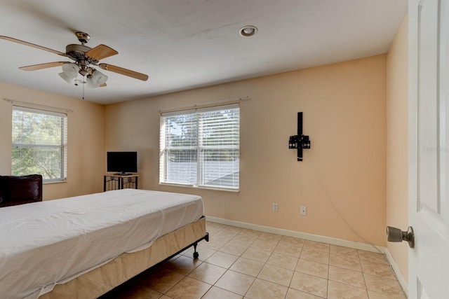 9 Shadow Ln, Ormond Beach, FL 32174 - tiled bedroom with multiple windows, baseboards, and a ceiling fan