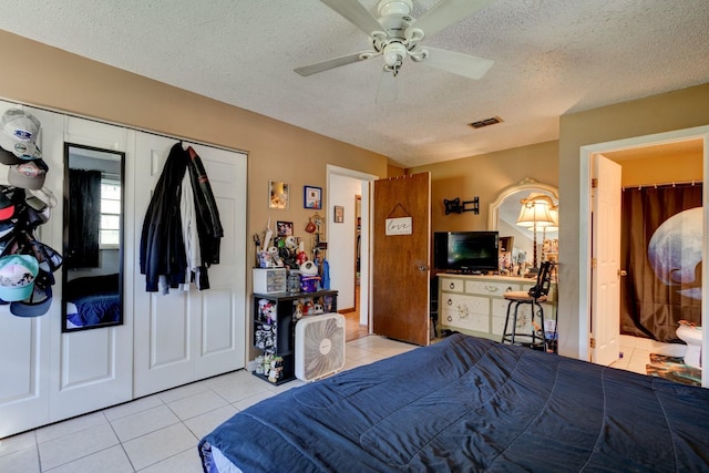 9 Shadow Ln, Ormond Beach, FL 32174 - tiled bedroom featuring a textured ceiling, a closet, and ceiling fan