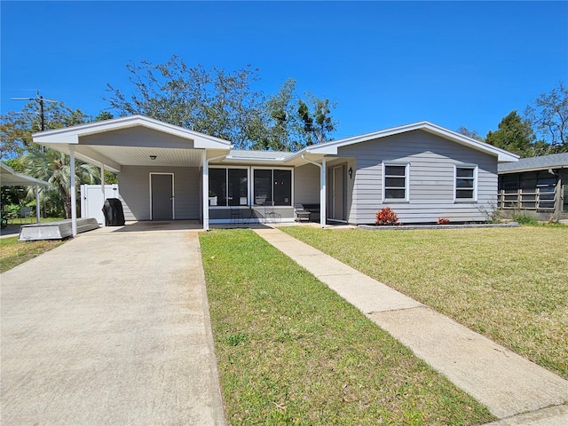 787 Alhambra Ave, Saint Augustine, FL 32086 - ranch-style home with a front lawn, an attached carport, and concrete driveway