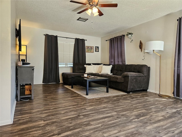 787 Alhambra Ave, Saint Augustine, FL 32086 - living room featuring a textured ceiling, wood finished floors, baseboards, and a ceiling fan
