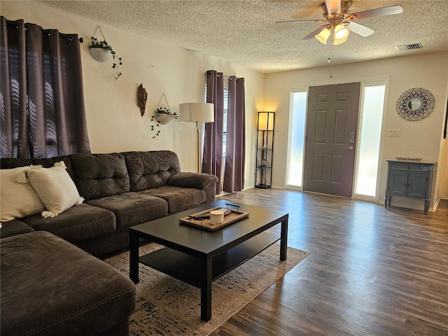 787 Alhambra Ave, Saint Augustine, FL 32086 - living room with a ceiling fan, wood finished floors, a textured ceiling, baseboards, and visible vents