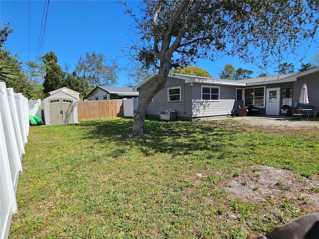 787 Alhambra Ave, Saint Augustine, FL 32086 - view of yard featuring a fenced backyard, an outbuilding, a patio, and a storage shed
