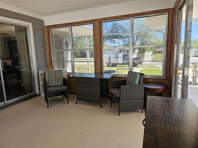 787 Alhambra Ave, Saint Augustine, FL 32086 - sunroom with carpet flooring and wood walls