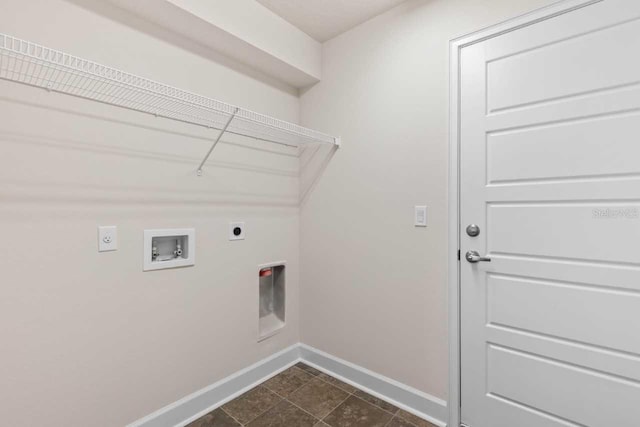 37 Rose Dr, Palm Coast, FL 32164 - clothes washing area featuring baseboards, dark tile patterned floors, washer hookup, laundry area, and electric dryer hookup
