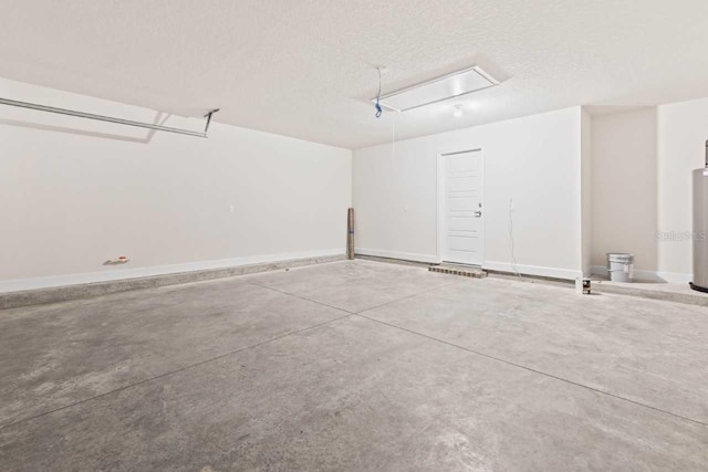 37 Rose Dr, Palm Coast, FL 32164 - garage featuring water heater and baseboards