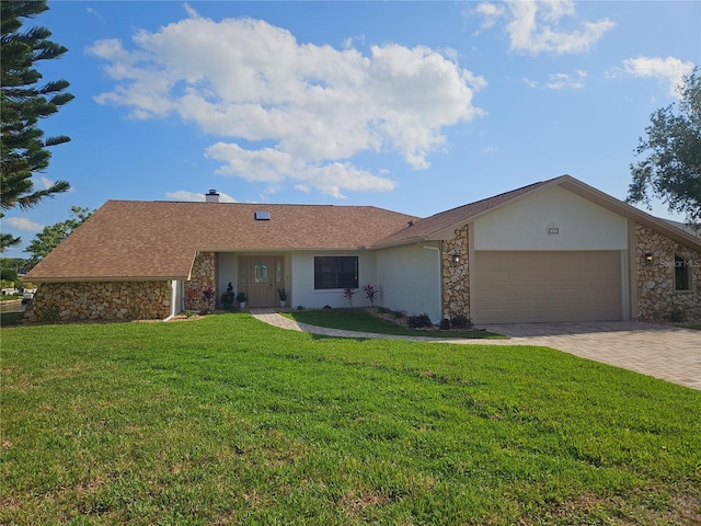 11 Cheyenne Ct, Palm Coast, FL 32137 - view of front of home featuring stone siding, an attached garage, stucco siding, and a front lawn