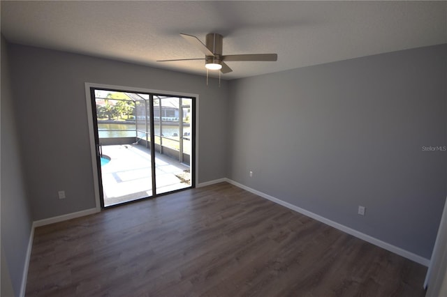 11 Cheyenne Ct, Palm Coast, FL 32137 - empty room featuring dark wood-type flooring, a ceiling fan, baseboards, and a textured ceiling