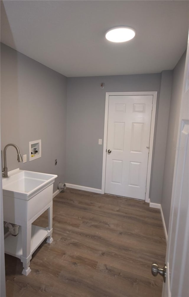 11 Cheyenne Ct, Palm Coast, FL 32137 - laundry area with hookup for a washing machine, baseboards, and dark wood-type flooring