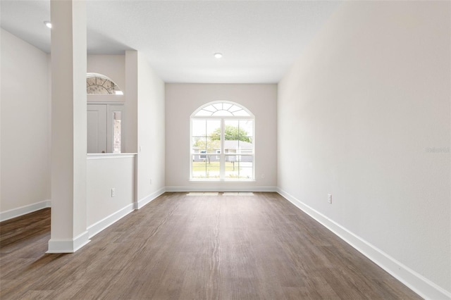 48 Sedgwick Trl, Palm Coast, FL 32164 - unfurnished room with baseboards and wood finished floors