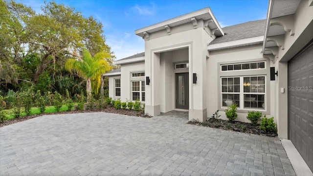 29 Old Oak Dr S, Palm Coast, FL 32137 - doorway to property featuring stucco siding