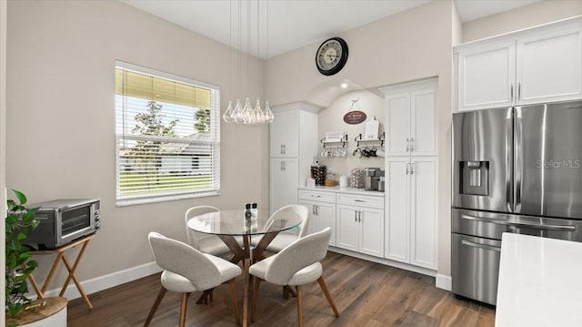 29 Old Oak Dr S, Palm Coast, FL 32137 - dining space featuring baseboards and dark wood finished floors