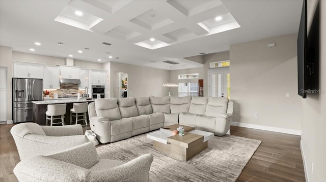 29 Old Oak Dr S, Palm Coast, FL 32137 - living room featuring coffered ceiling, recessed lighting, dark wood-type flooring, baseboards, and beam ceiling