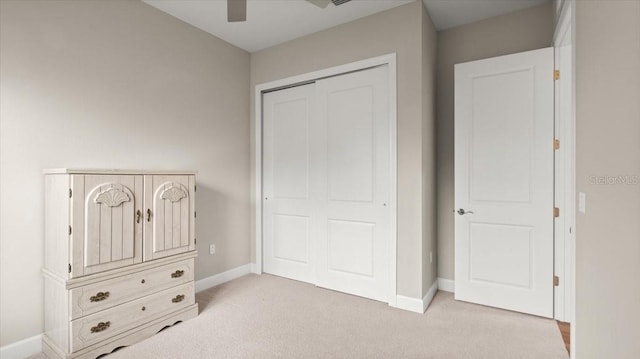 29 Old Oak Dr S, Palm Coast, FL 32137 - unfurnished bedroom with a closet, ceiling fan, baseboards, and light colored carpet