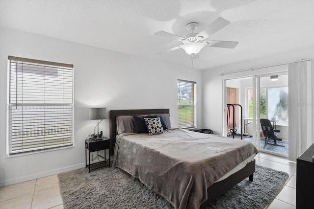 bedroom with a ceiling fan, light tile patterned floors, baseboards, and access to outside