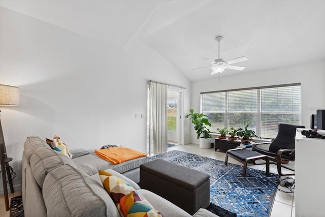 tiled living area featuring a ceiling fan and vaulted ceiling