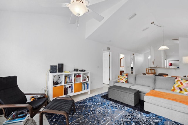 living room featuring light tile patterned floors, visible vents, lofted ceiling, and ceiling fan