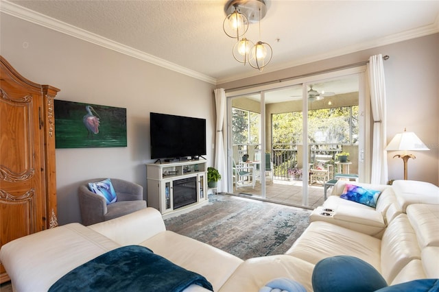 45 Riverview Bnd S Unit 1937, Palm Coast, FL 32137 - living area featuring crown molding, wood finished floors, a textured ceiling, and a glass covered fireplace