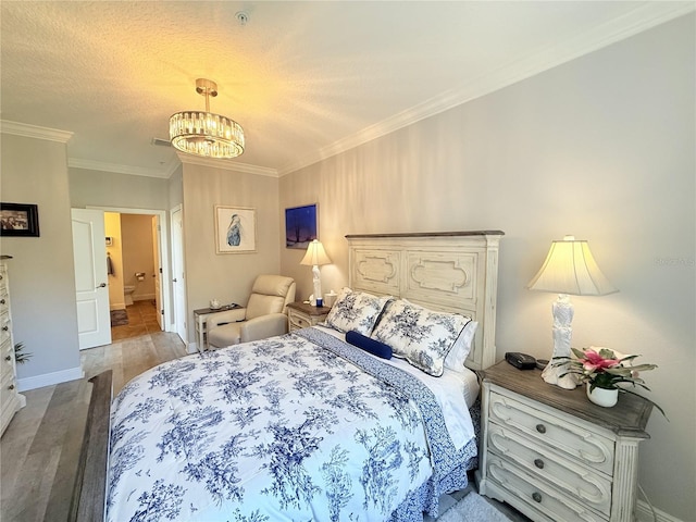 45 Riverview Bnd S Unit 1937, Palm Coast, FL 32137 - bedroom featuring wood finished floors, a chandelier, crown molding, and baseboards