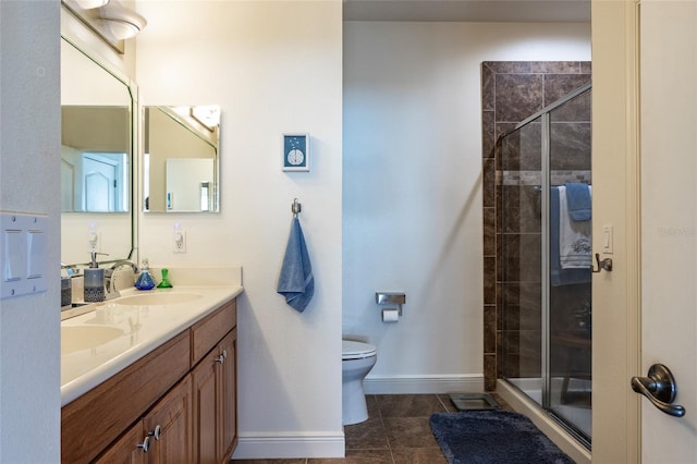 45 Riverview Bnd S Unit 1937, Palm Coast, FL 32137 - full bathroom featuring a stall shower, toilet, double vanity, baseboards, and tile patterned floors