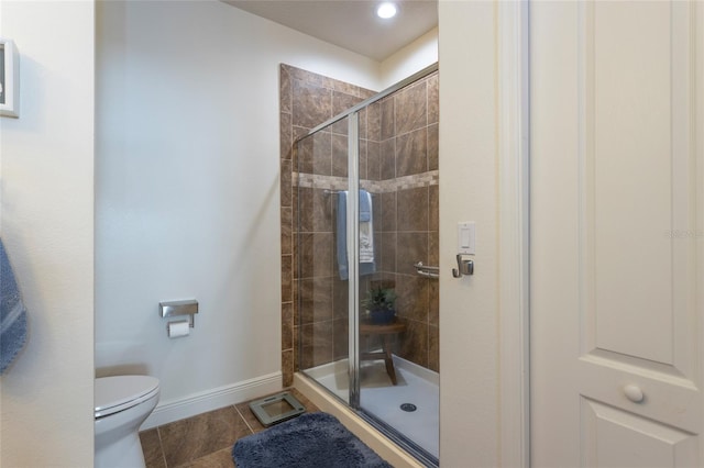 45 Riverview Bnd S Unit 1937, Palm Coast, FL 32137 - full bath with a stall shower, toilet, baseboards, and tile patterned flooring
