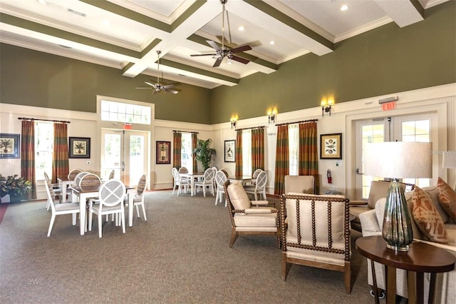 45 Riverview Bnd S Unit 1937, Palm Coast, FL 32137 - dining room with a towering ceiling, beamed ceiling, coffered ceiling, a ceiling fan, and ornamental molding