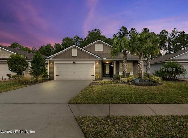 324 Palace Dr, Saint Augustine, FL 32084 - view of front facade with driveway, a lawn, board and batten siding, and a garage