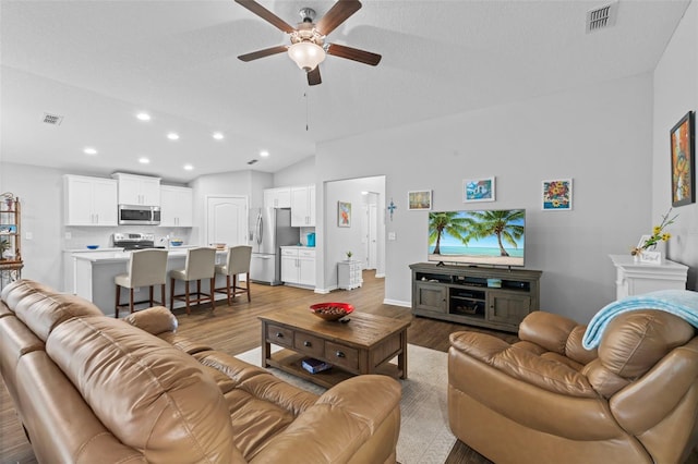 324 Palace Dr, Saint Augustine, FL 32084 - living room featuring ceiling fan, vaulted ceiling, wood finished floors, and recessed lighting