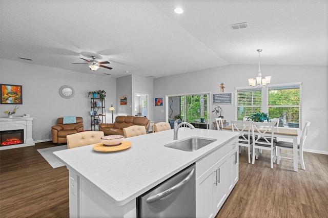 324 Palace Dr, Saint Augustine, FL 32084 - kitchen featuring dishwasher, dark wood-style floors, a center island with sink, white cabinets, and open floor plan