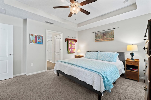 324 Palace Dr, Saint Augustine, FL 32084 - carpeted bedroom with a raised ceiling and a ceiling fan