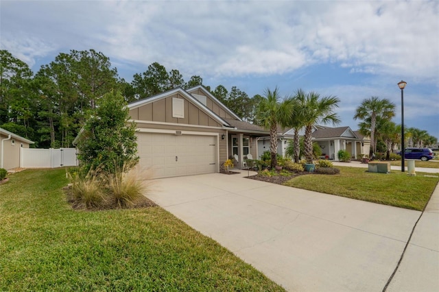 324 Palace Dr, Saint Augustine, FL 32084 - view of front of house featuring board and batten siding, a garage, and concrete driveway