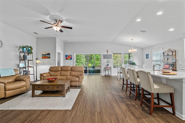 324 Palace Dr, Saint Augustine, FL 32084 - living area featuring dark wood finished floors, a ceiling fan, vaulted ceiling, a chandelier, and recessed lighting